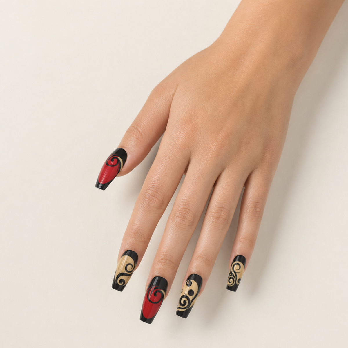 Crimson Gothic Swirl red black and beige press-on nails worn on hand