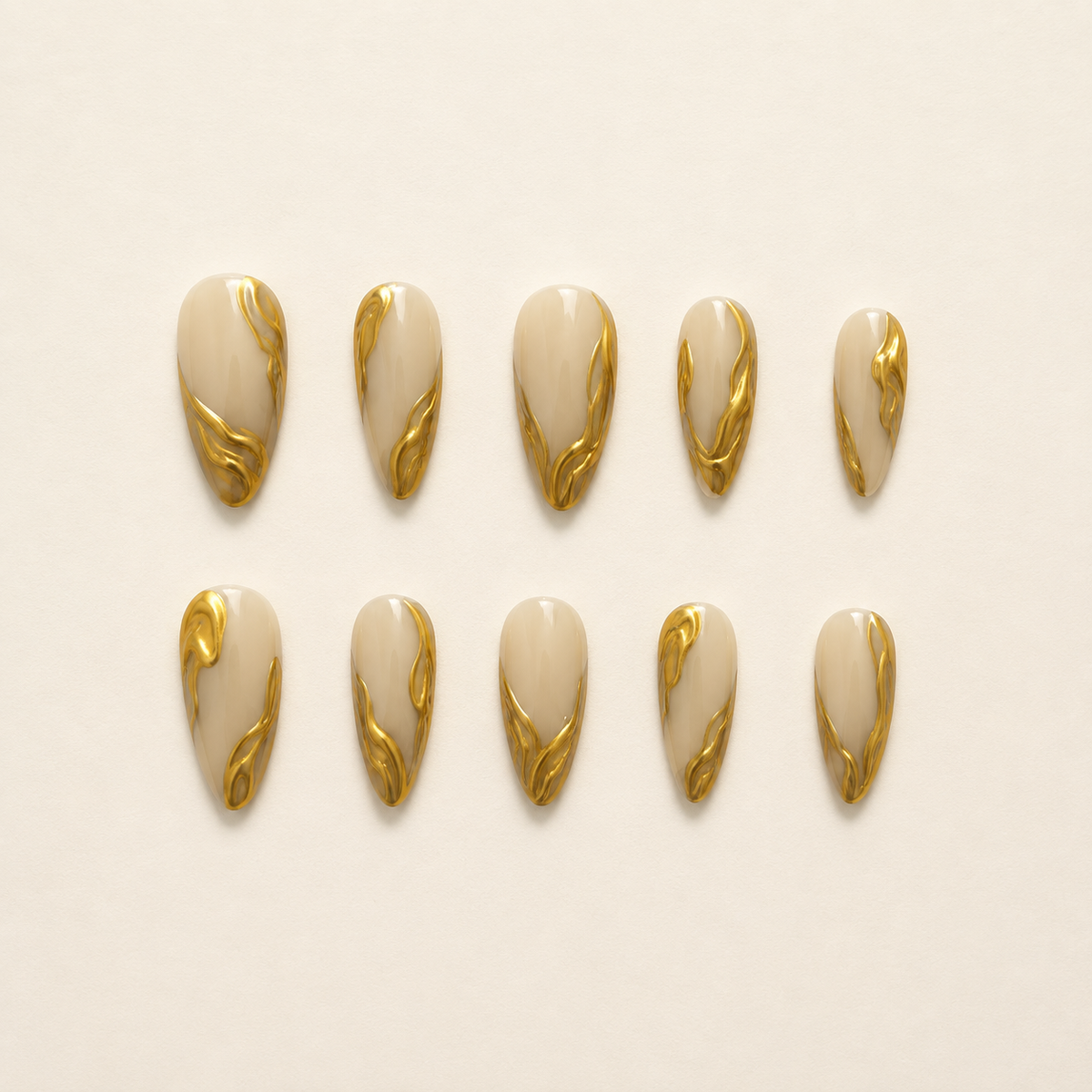 Gilded Elegance | Nude 3D Gold Swirl Press-On Nails flat lay