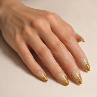 Gilded Elegance | Nude 3D Gold Swirl Press-On Nails worn on hand