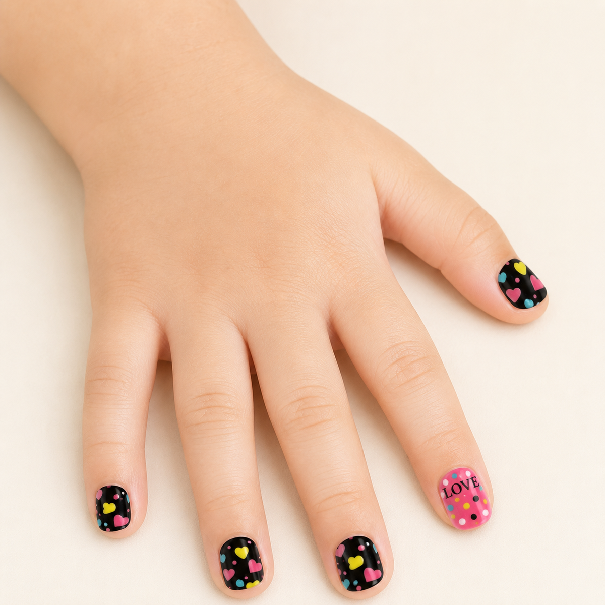 Sweetheart Pop | Hearts & LOVE Kids Press-On Nails worn on a child's hand
