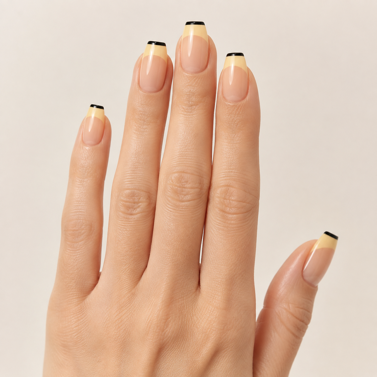 Modern Minimalist | Yellow & Black French Tip Press-On Nails hand shot