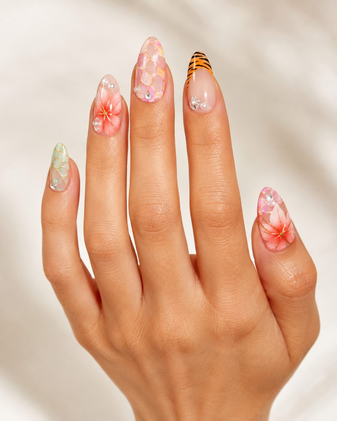 Island Sunset Pastel Floral & Animal Print Almond Press-On Nails worn on hand