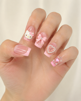 Kawaii Kitty Coquette Pink French Tip Press-On Nails worn on hand