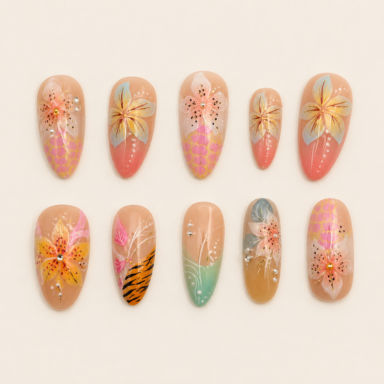 Tropical Sunset Hibiscus & Tiger Print Almond Press-On Nails flat lay