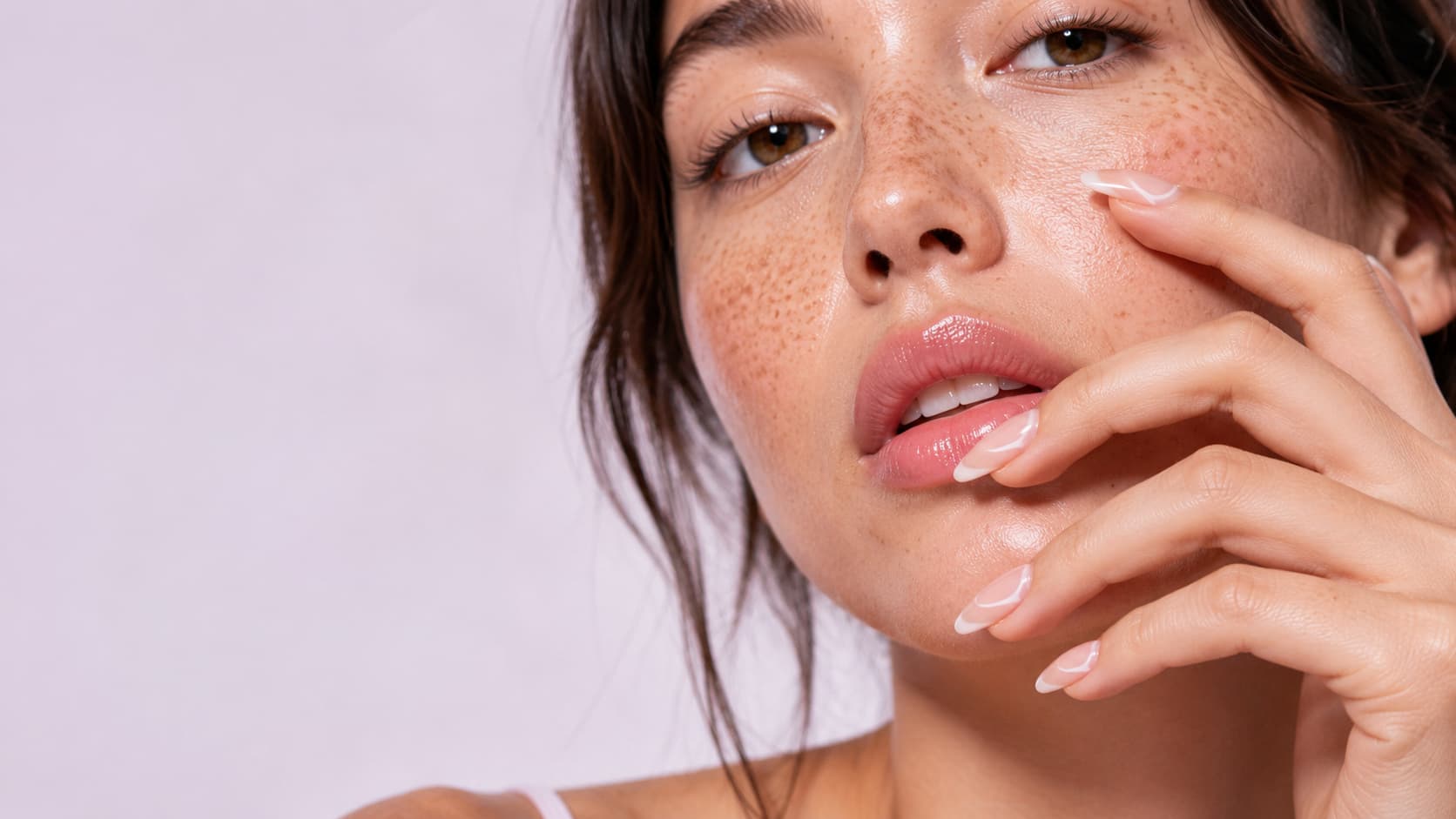 Model wearing a neutral press-on nail style