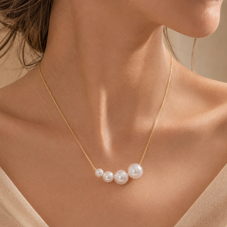 Model wearing Graduated Pearl Gold Necklace