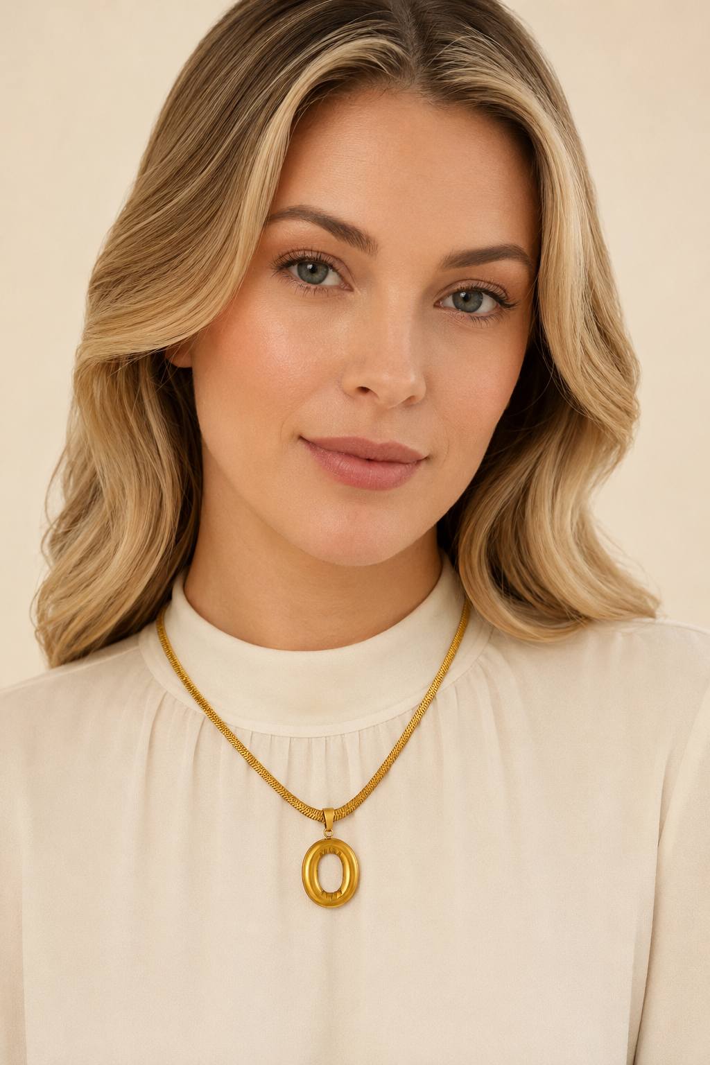 Model wearing Puffy Initial Gold Pendant Necklace – O