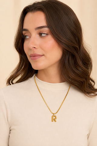 Model wearing Puffy Initial Gold Pendant Necklace – R