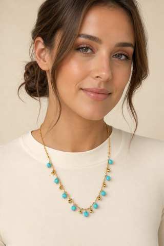 Model wearing Turquoise Multi-Charm Gold Necklace